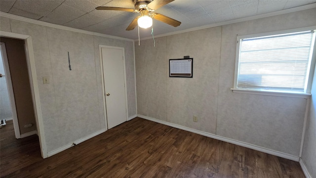 897 Sunset Dr, Abilene, TX 79605 - unfurnished bedroom featuring crown molding, dark wood-style floors, baseboards, and a ceiling fan