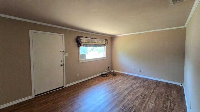 897 Sunset Dr, Abilene, TX 79605 - spare room with wood finished floors, ornamental molding, and baseboards