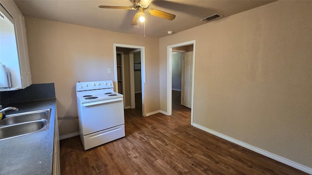 897 Sunset Dr, Abilene, TX 79605 - kitchen featuring white range with electric stovetop, a sink, dark wood-type flooring, ceiling fan, and baseboards