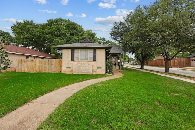 bungalow with brick siding and a shingled roof