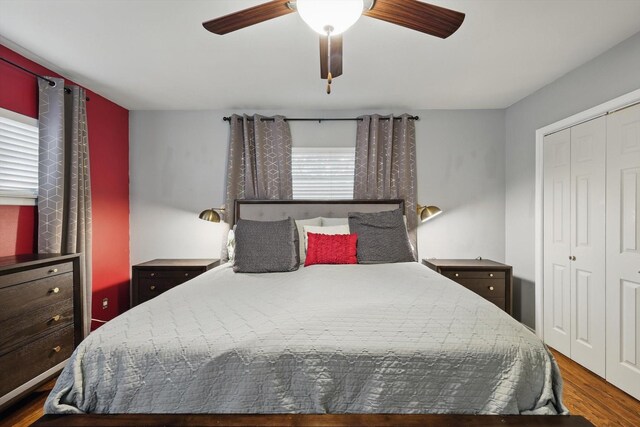 bedroom featuring wood finished floors, a closet, and a ceiling fan