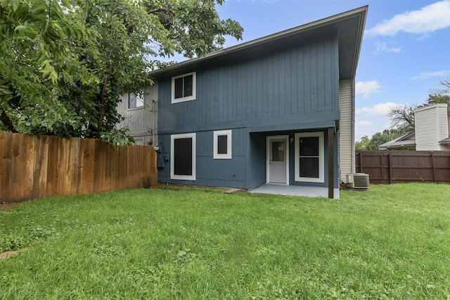 rear view of property featuring central AC unit