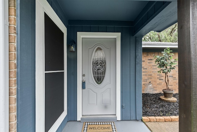 property entrance with brick siding