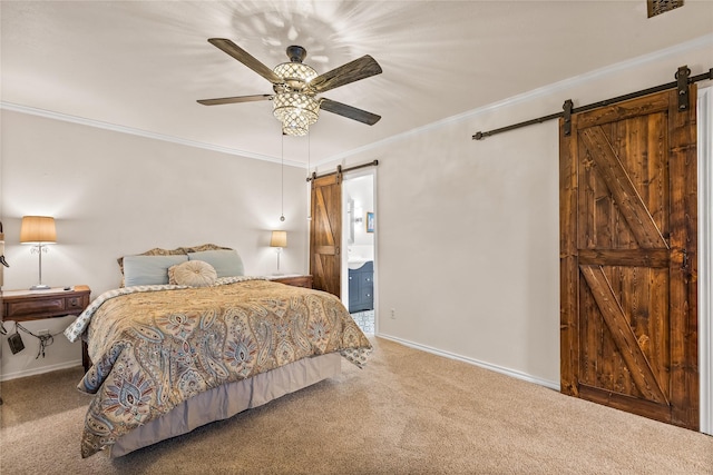 bedroom with a barn door, carpet, ornamental molding, and baseboards
