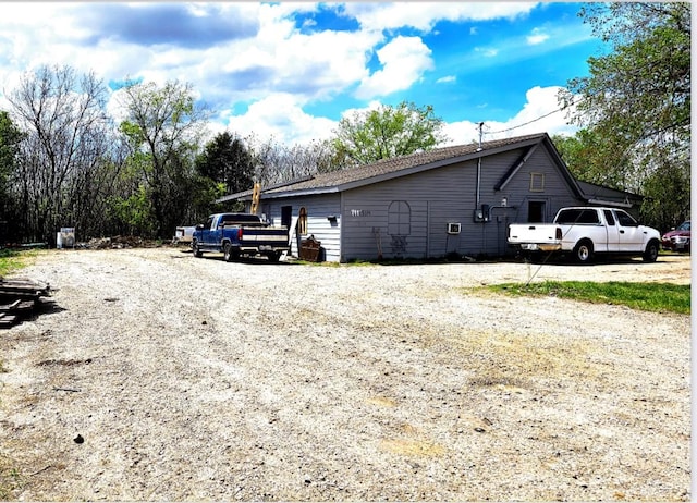 view of home's exterior featuring gravel driveway