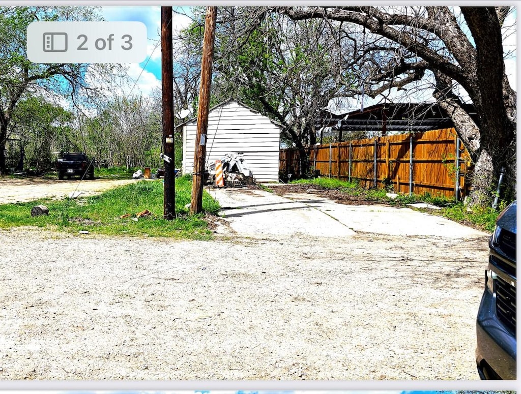 view of yard with fence
