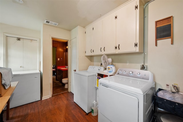 201 Sunset Dr, Fairfield, TX 75840 - washroom featuring cabinet space, washer and dryer, and dark wood-type flooring