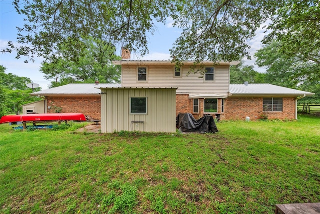 201 Sunset Dr, Fairfield, TX 75840 - rear view of house with a chimney and brick siding