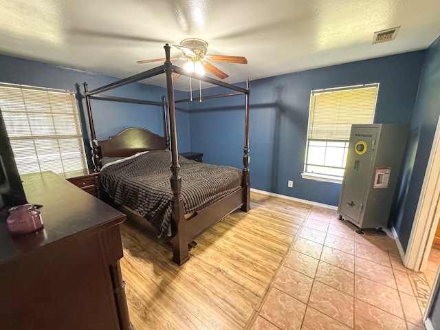 3836 Farm Road 196 N, Paris, TX 75462 - bedroom with ceiling fan, baseboards, and light tile patterned floors