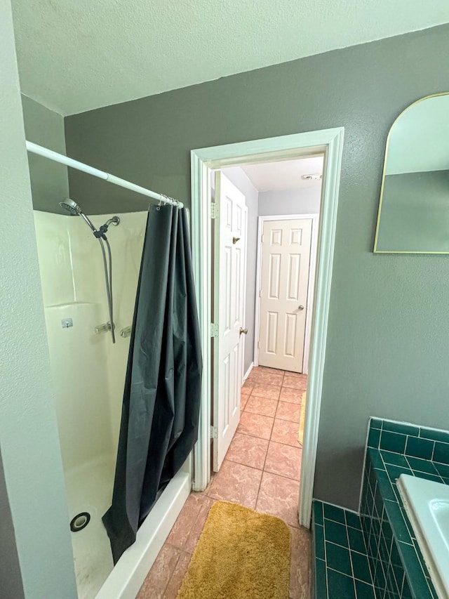3836 Farm Road 196 N, Paris, TX 75462 - full bath with a shower with shower curtain, tile patterned flooring, and tiled bath