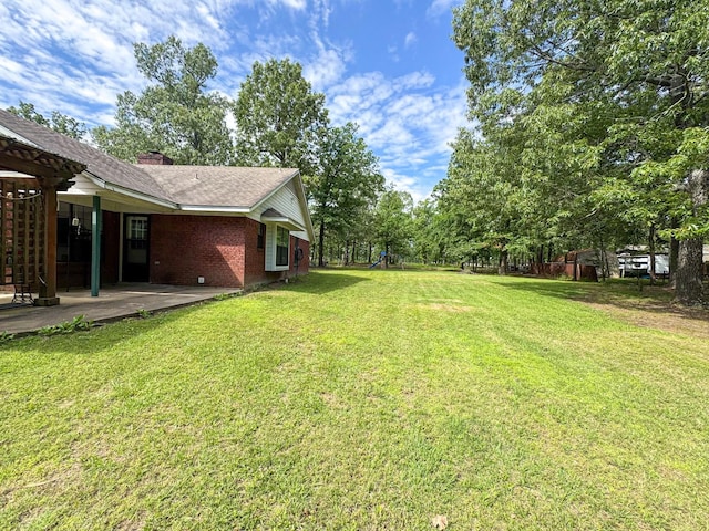 3836 Farm Road 196 N, Paris, TX 75462 - view of grassy yard featuring a patio