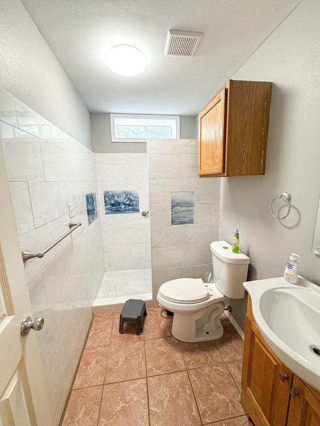 3836 Farm Road 196 N, Paris, TX 75462 - full bathroom with toilet, walk in shower, vanity, and a textured ceiling