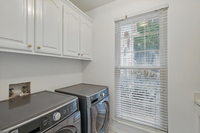 2413 Oak Brook Dr, Bedford, TX 76021 - laundry room with washer and clothes dryer and cabinet space