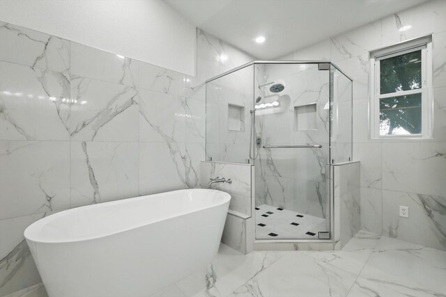 2413 Oak Brook Dr, Bedford, TX 76021 - full bath featuring a marble finish shower, a freestanding bath, tile walls, and marble tiled floors