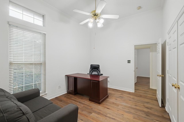 2413 Oak Brook Dr, Bedford, TX 76021 - home office featuring crown molding, ceiling fan, light wood finished floors, baseboards, and a towering ceiling