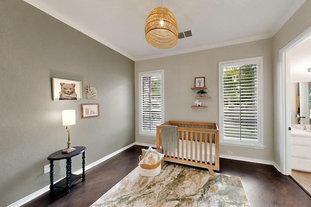 3001 Pecan Grove Ln, Celina, TX 75078 - bedroom with dark wood-style floors, crown molding, baseboards, and connected bathroom