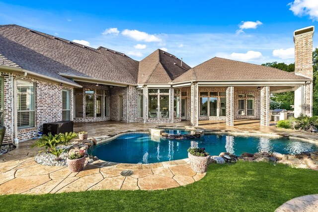 3001 Pecan Grove Ln, Celina, TX 75078 - view of swimming pool featuring a patio, a pool with connected hot tub, a lawn, and grilling area