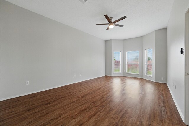 2763 Beverly Dr, Rockwall, TX 75032 - empty room with wood finished floors, a ceiling fan, and baseboards