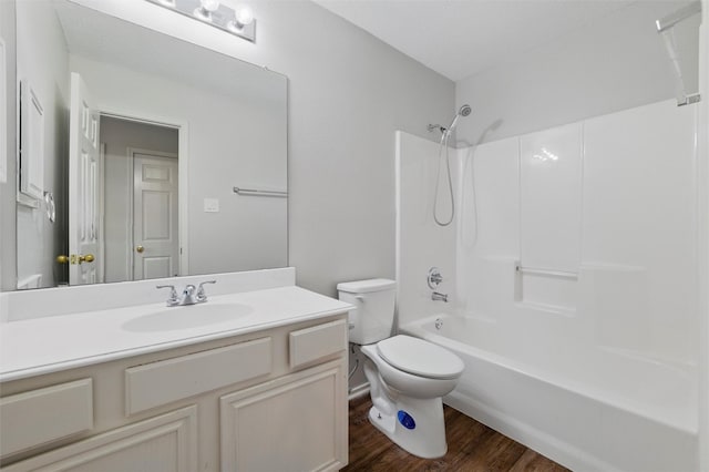 2763 Beverly Dr, Rockwall, TX 75032 - full bath featuring wood finished floors, toilet, vanity, and tub / shower combination