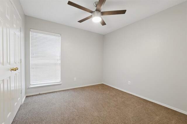 2763 Beverly Dr, Rockwall, TX 75032 - unfurnished room with carpet flooring, ceiling fan, baseboards, and plenty of natural light