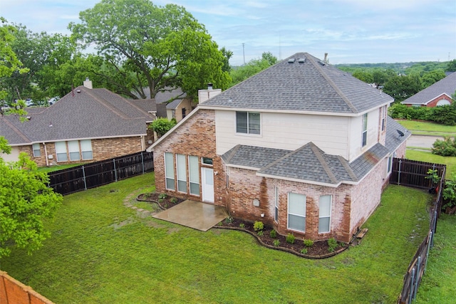 2763 Beverly Dr, Rockwall, TX 75032 - back of house featuring roof with shingles, a patio area, and brick siding