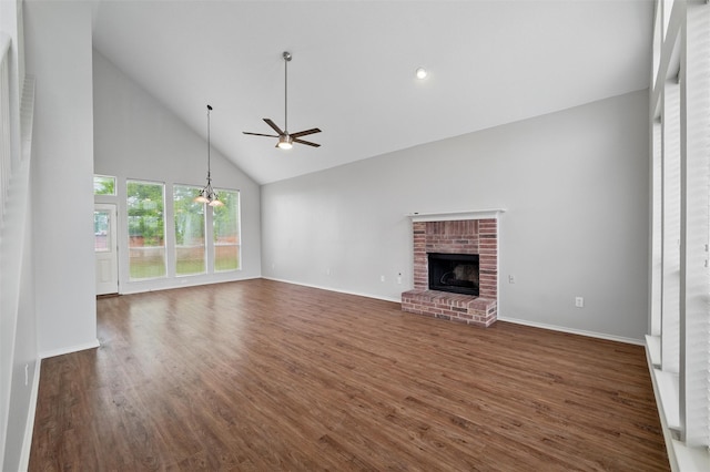 2763 Beverly Dr, Rockwall, TX 75032 - unfurnished living room with ceiling fan, high vaulted ceiling, a fireplace, dark wood-type flooring, and baseboards
