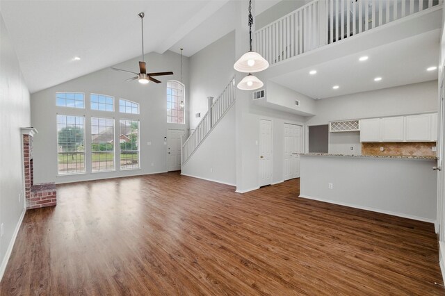 2763 Beverly Dr, Rockwall, TX 75032 - unfurnished living room featuring high vaulted ceiling, a ceiling fan, dark wood-style floors, baseboards, and recessed lighting