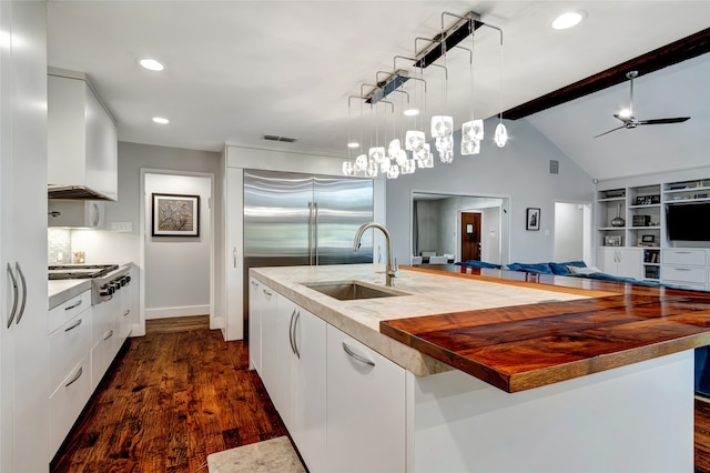 6522 Willow Ln, Dallas, TX 75230 - kitchen featuring a sink, stainless steel appliances, modern cabinets, white cabinetry, and recessed lighting