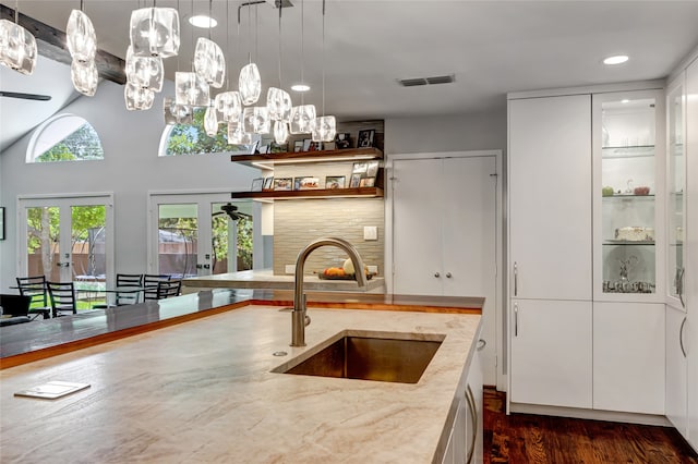 6522 Willow Ln, Dallas, TX 75230 - kitchen featuring a sink, french doors, white cabinetry, recessed lighting, and hanging light fixtures