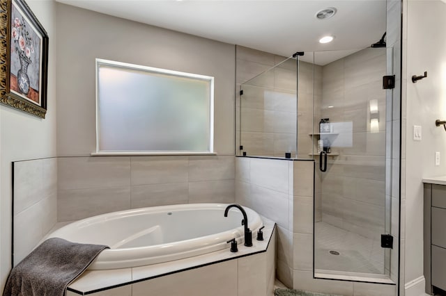 6522 Willow Ln, Dallas, TX 75230 - full bathroom with a garden tub, a stall shower, vanity, and recessed lighting