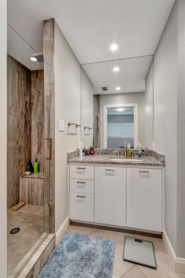 6522 Willow Ln, Dallas, TX 75230 - bathroom featuring a shower stall, vanity, tile patterned floors, baseboards, and recessed lighting