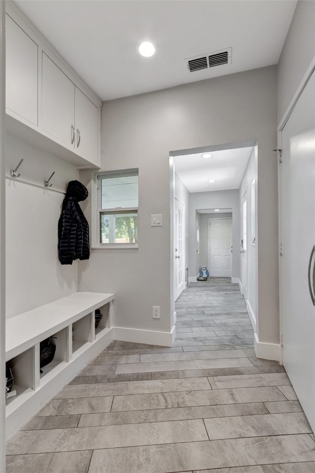 6522 Willow Ln, Dallas, TX 75230 - mudroom with baseboards, light wood-style flooring, and recessed lighting
