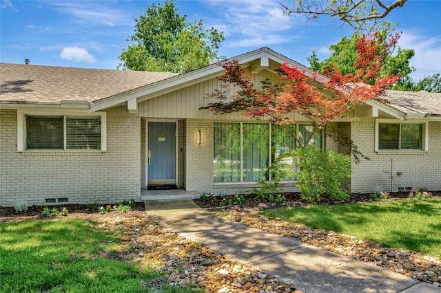 6522 Willow Ln, Dallas, TX 75230 - view of front of property with brick siding, roof with shingles, a front yard, and crawl space