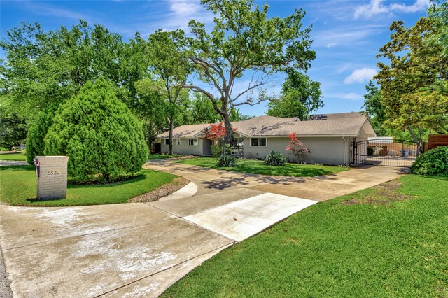 6522 Willow Ln, Dallas, TX 75230 - view of yard featuring concrete driveway and a gate