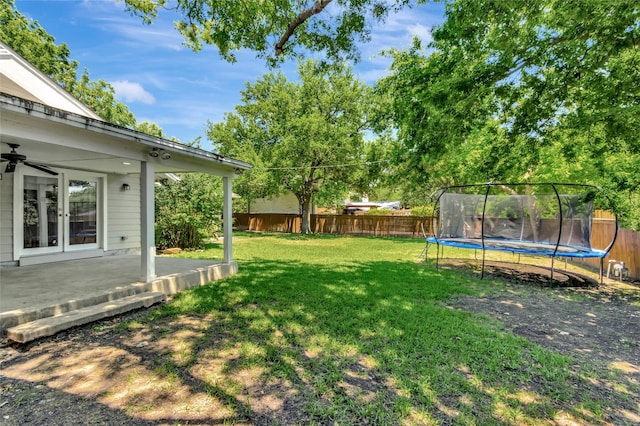 6522 Willow Ln, Dallas, TX 75230 - view of yard featuring a trampoline, ceiling fan, french doors, and a patio area