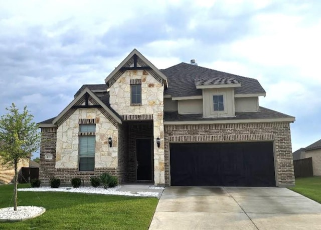 french country inspired facade featuring stone siding, concrete driveway, a front yard, and a shingled roof