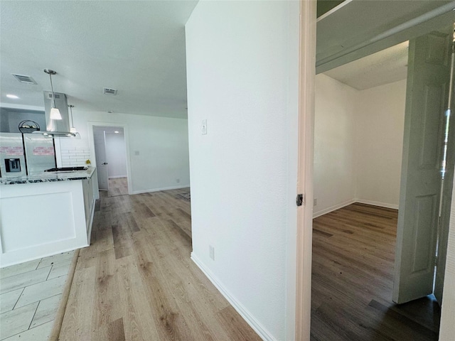2719 S 27th, Waco, TX 76706 - hallway with light wood finished floors and baseboards