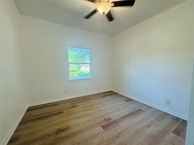 2719 S 27th, Waco, TX 76706 - unfurnished room with wood finished floors, ceiling fan, and baseboards