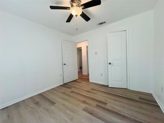 2719 S 27th, Waco, TX 76706 - unfurnished bedroom with light wood-style floors, baseboards, and a ceiling fan