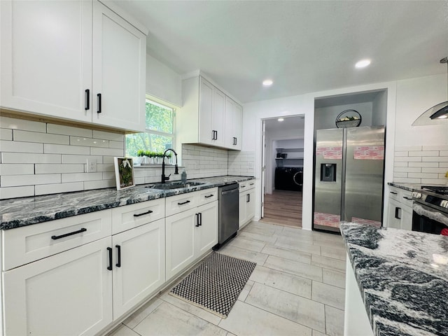 2719 S 27th, Waco, TX 76706 - kitchen featuring appliances with stainless steel finishes, a sink, backsplash, white cabinetry, and recessed lighting