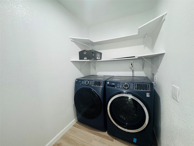 2719 S 27th, Waco, TX 76706 - laundry room with washer and dryer, baseboards, and wood finished floors