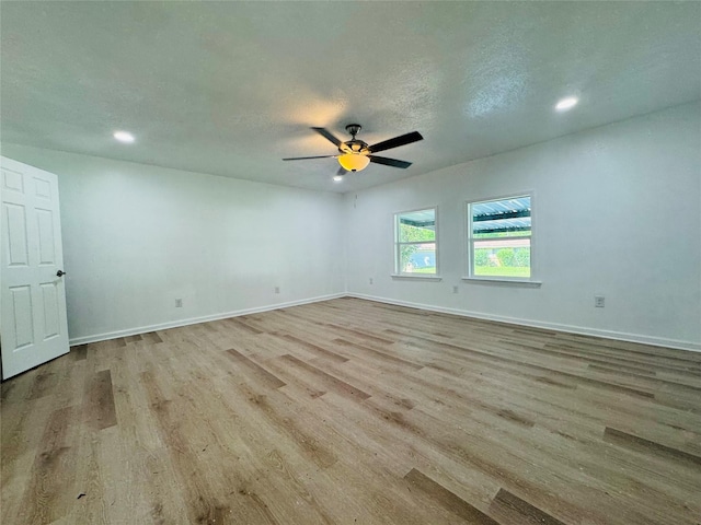 2719 S 27th, Waco, TX 76706 - unfurnished room featuring wood finished floors, baseboards, recessed lighting, and ceiling fan