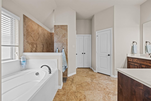 2725 Buffalo Run, Burleson, TX 76028 - full bath with a garden tub, healthy amount of natural light, vanity, and baseboards