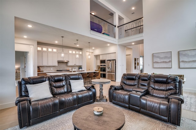 2309 Albion Way, Forney, TX 75126 - living room with baseboards, a high ceiling, and recessed lighting