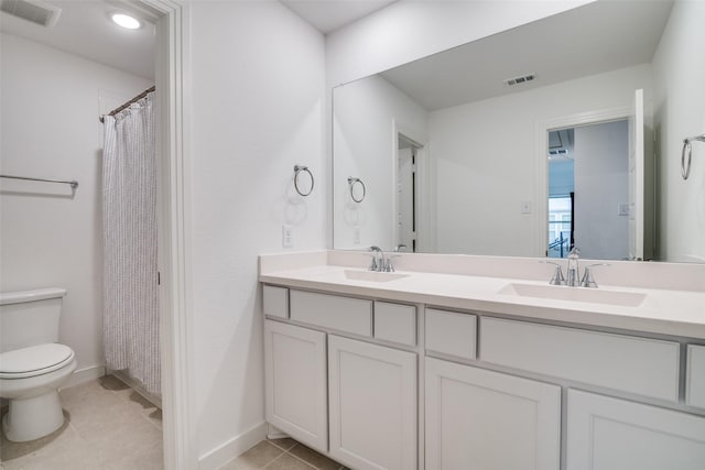 2309 Albion Way, Forney, TX 75126 - bathroom with toilet, double vanity, tile patterned flooring, and baseboards