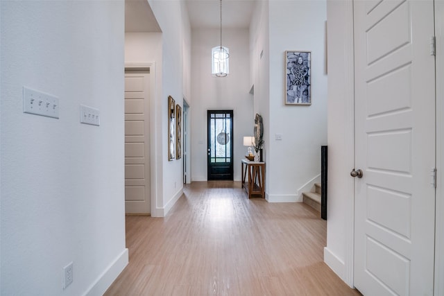 2309 Albion Way, Forney, TX 75126 - entryway featuring healthy amount of natural light, baseboards, light wood finished floors, stairway, and a high ceiling