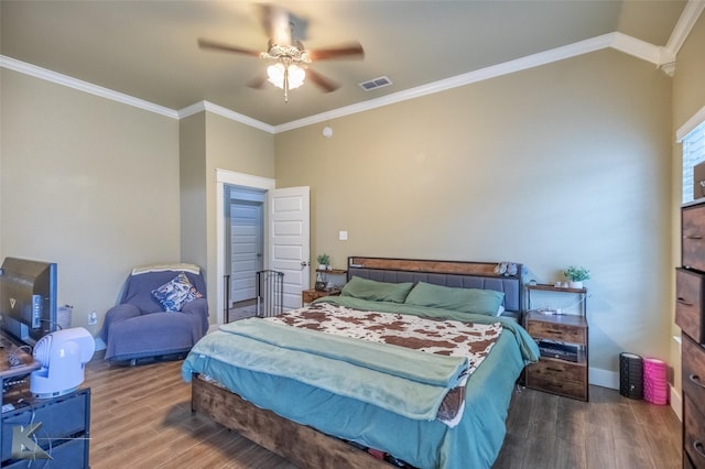 1001 Cabernet Dr, Abilene, TX 79601 - bedroom with wood finished floors, crown molding, ceiling fan, baseboards, and lofted ceiling