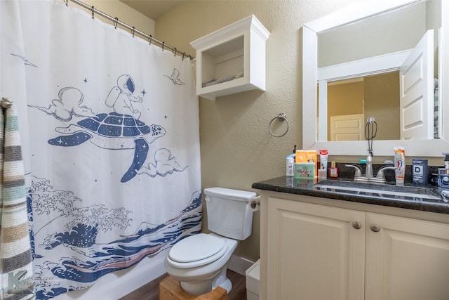 1001 Cabernet Dr, Abilene, TX 79601 - full bathroom with a textured wall, vanity, toilet, and a shower with shower curtain