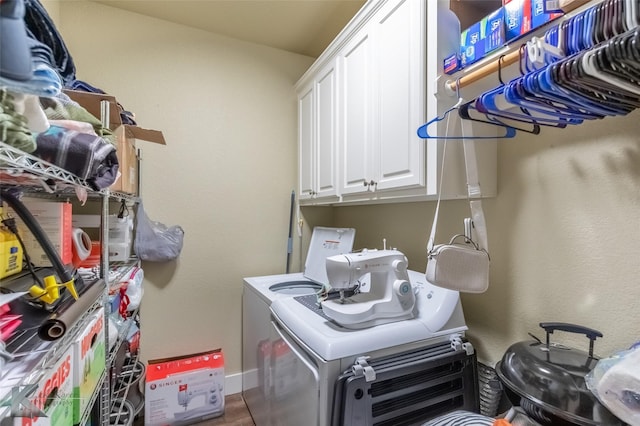 1001 Cabernet Dr, Abilene, TX 79601 - laundry area with cabinet space, washer and dryer, and baseboards