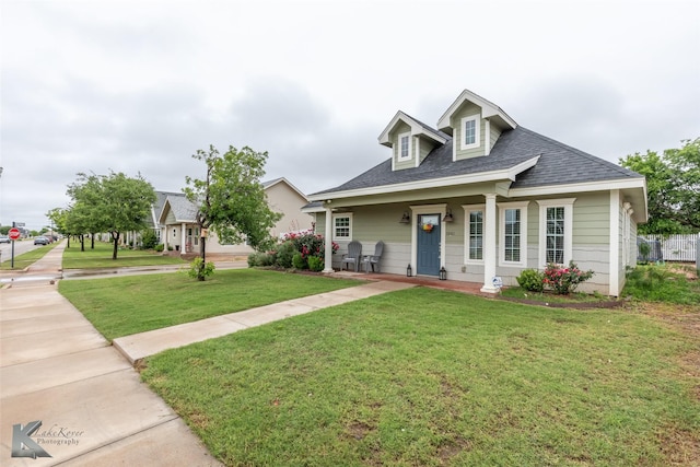 1001 Cabernet Dr, Abilene, TX 79601 - view of front facade featuring a front lawn and a shingled roof